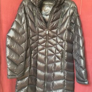 Down filled knee length Black coat.